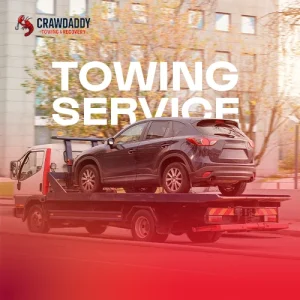Flatbed tow truck transporting SUV highlighting reliable 24/7 emergency towing service