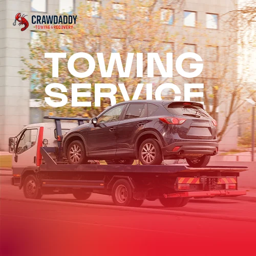 Flatbed tow truck transporting SUV highlighting reliable 24/7 emergency towing service