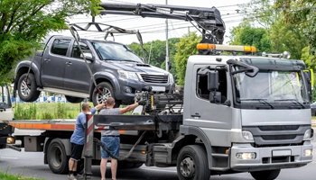 Utility tow truck equipped for commercial towing and roadside assistance.