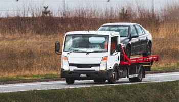 Tow truck responding to a roadside assistance and towing call.