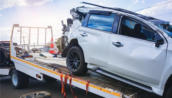 Accident-damaged vehicles being recovered by Crawdaddy Towing after a roadside collision.